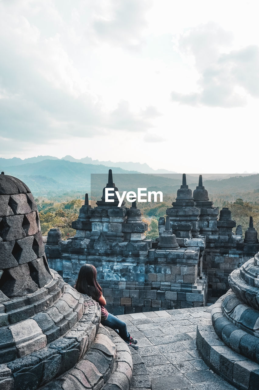 ANCIENT TEMPLE AGAINST BUILDINGS