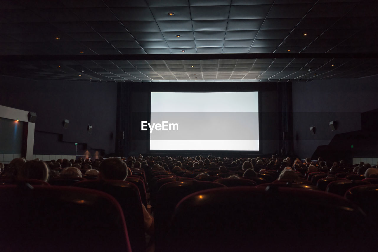 Rear view of audience in movie theater