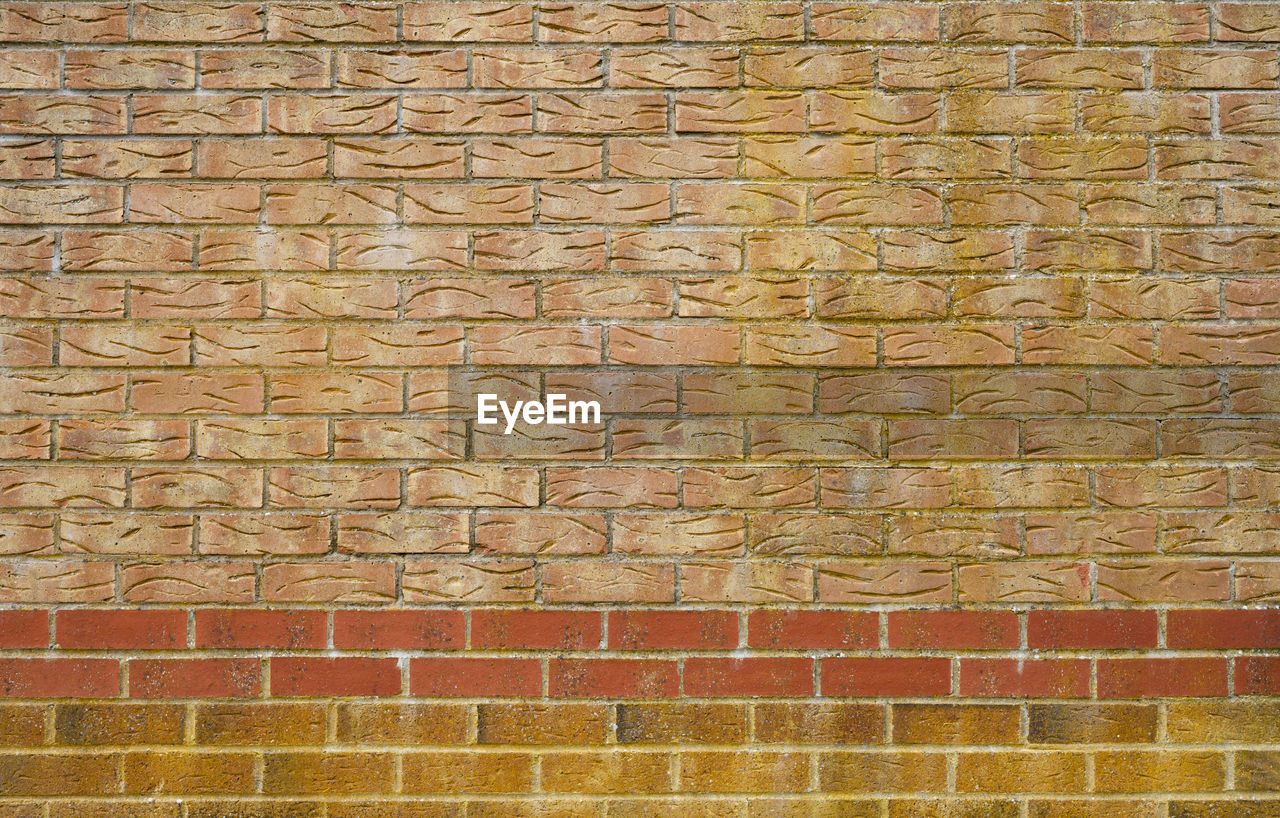 TEXT ON BRICK WALL