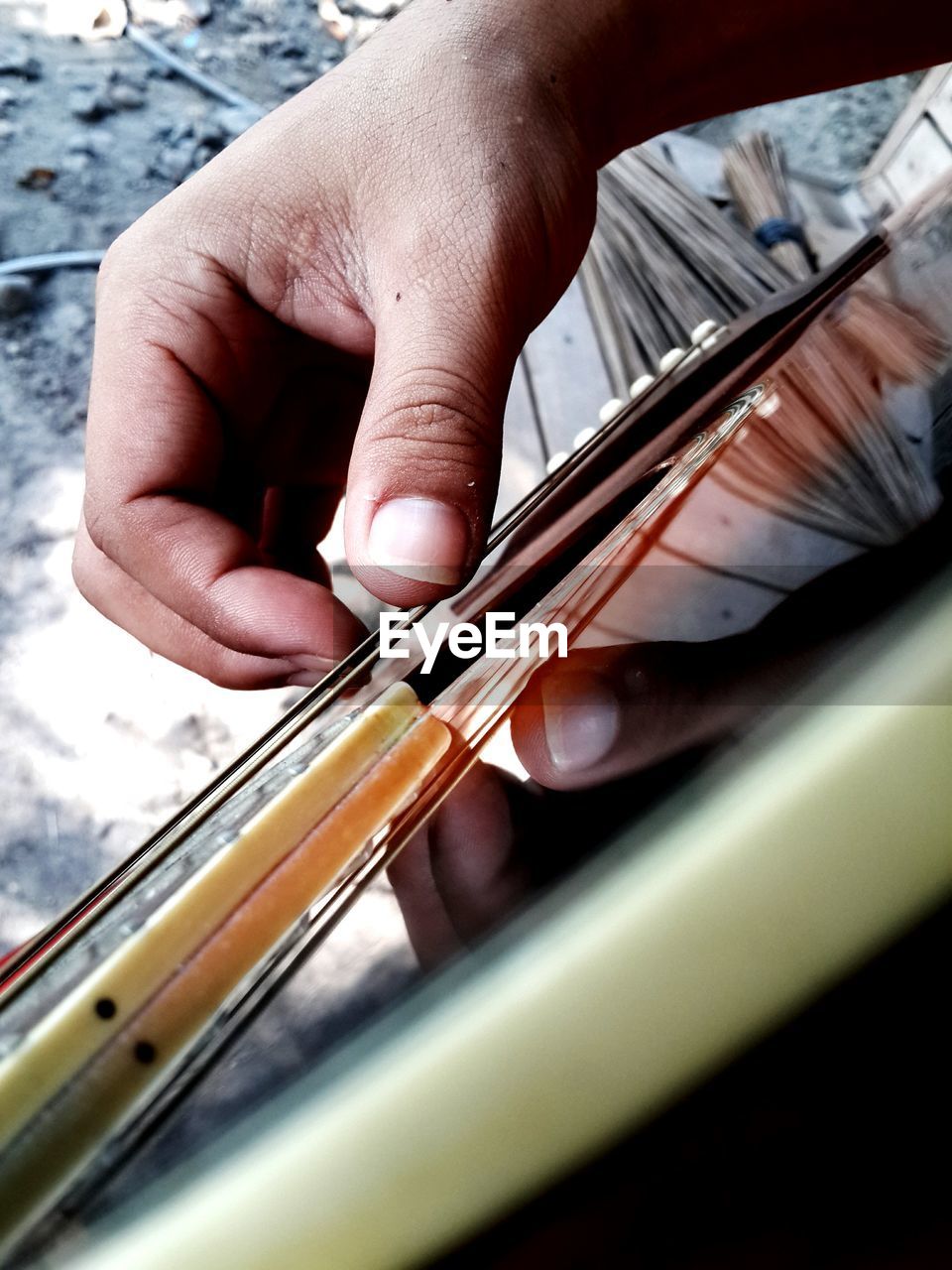 Cropped image of man playing guitar