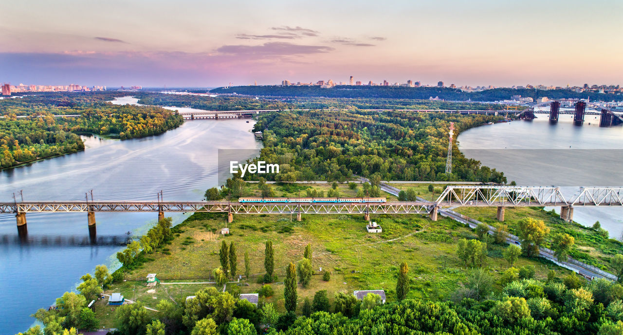 AERIAL VIEW OF BRIDGE OVER RIVER AGAINST SKY