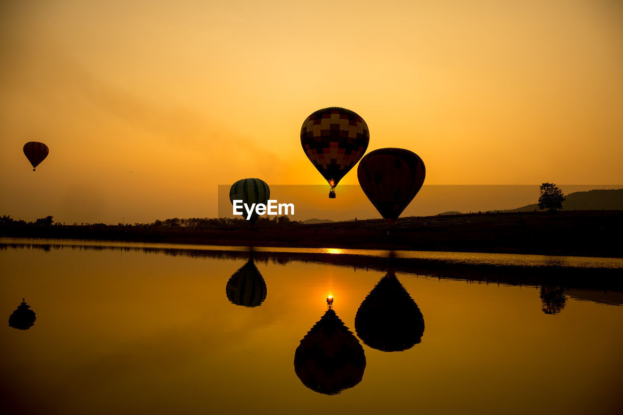 VIEW OF HOT AIR BALLOON IN LAKE
