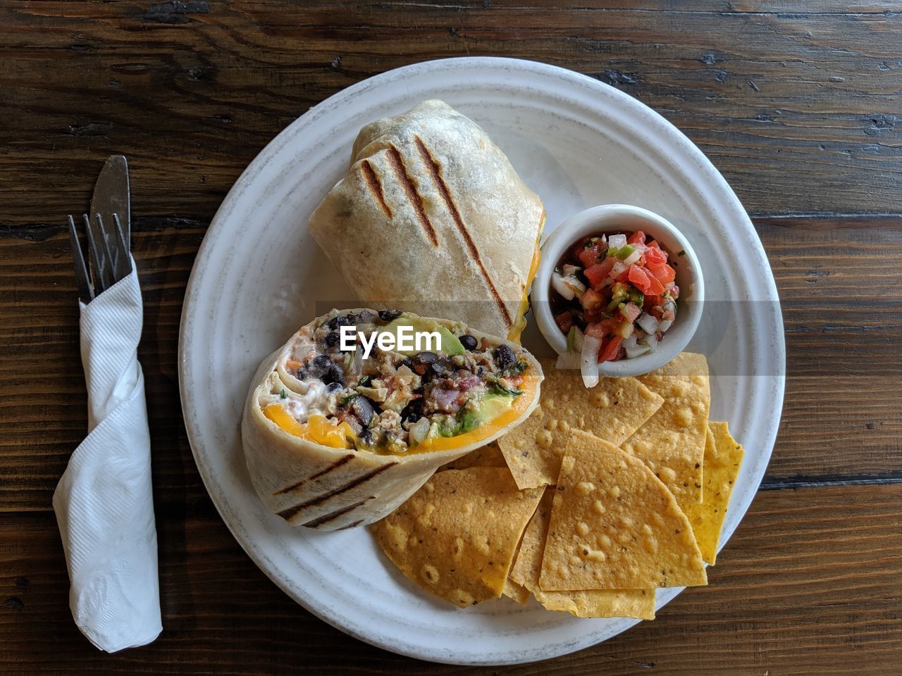 High angle view of burrito breakfast on table