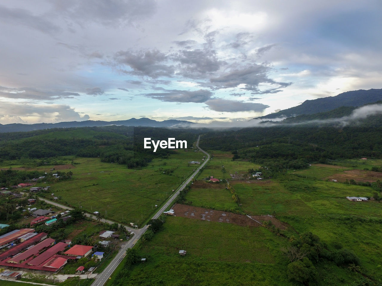 HIGH ANGLE VIEW OF LAND AND MOUNTAINS AGAINST SKY