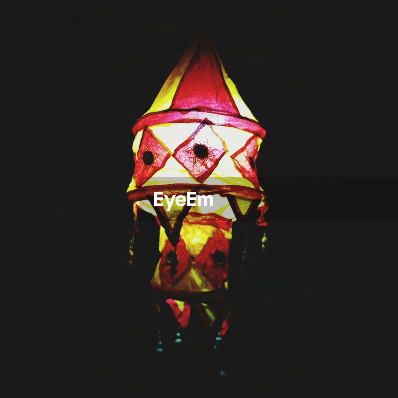 CLOSE-UP OF MULTI COLORED LIGHT OVER BLACK BACKGROUND