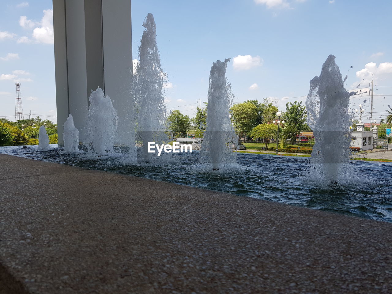 WATER SPLASHING ON FOUNTAIN AGAINST SKY