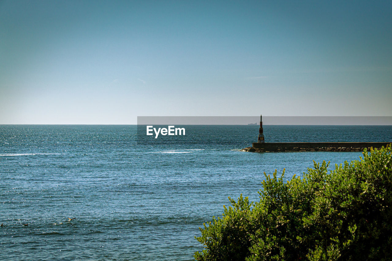 VIEW OF SEA AGAINST CLEAR SKY