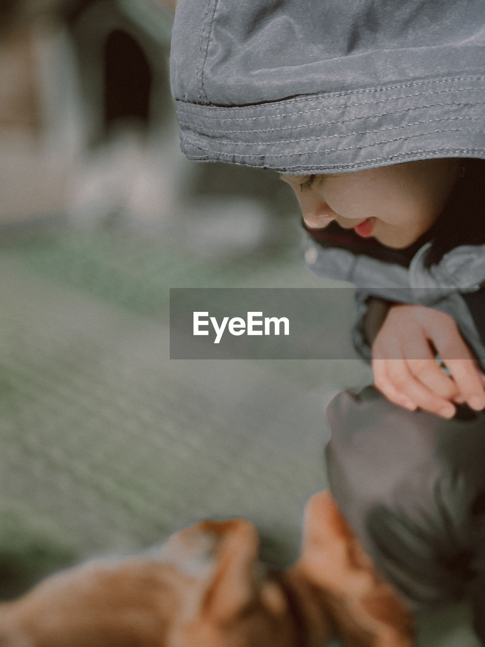 Close-up of woman looking at dog