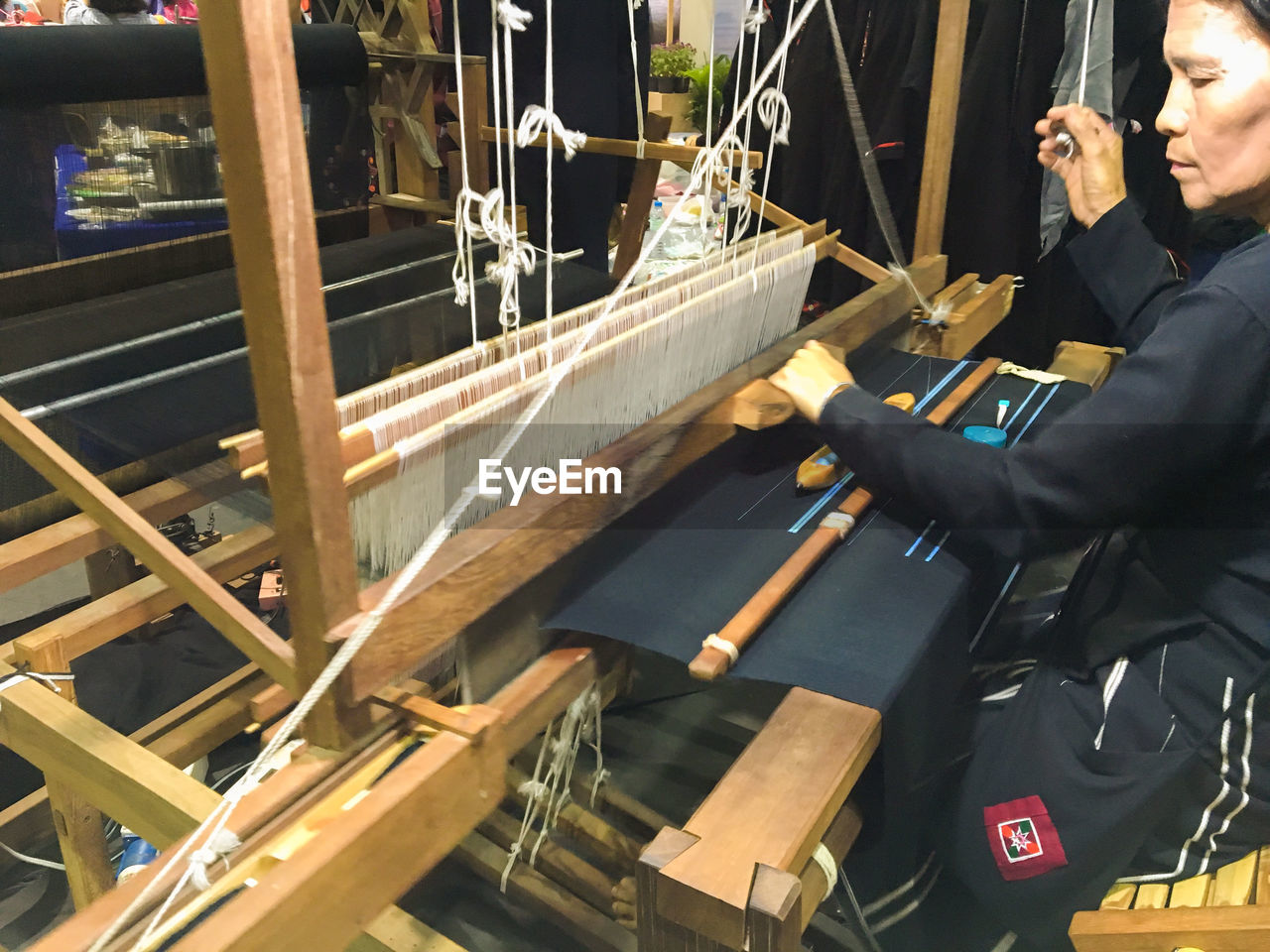 Woman working on handloom