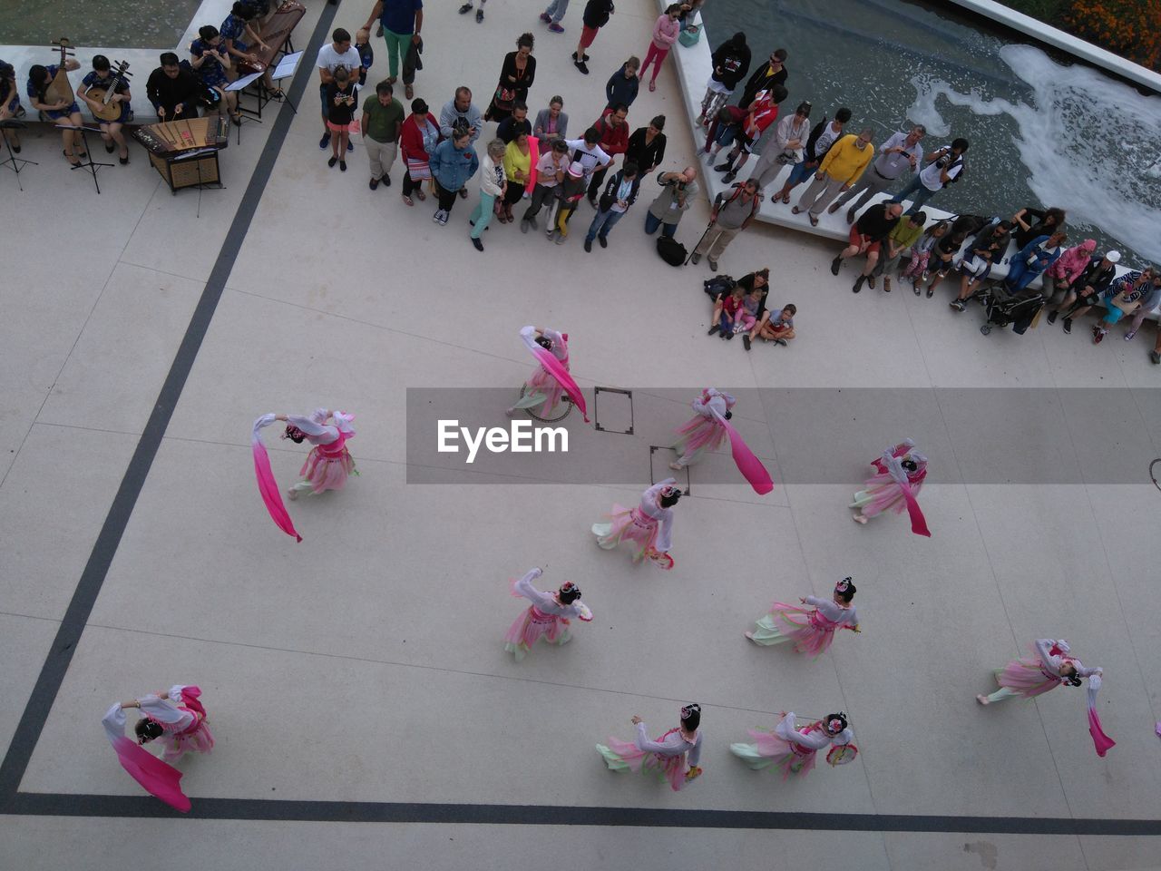 HIGH ANGLE VIEW OF PEOPLE ON FLOWER PETALS
