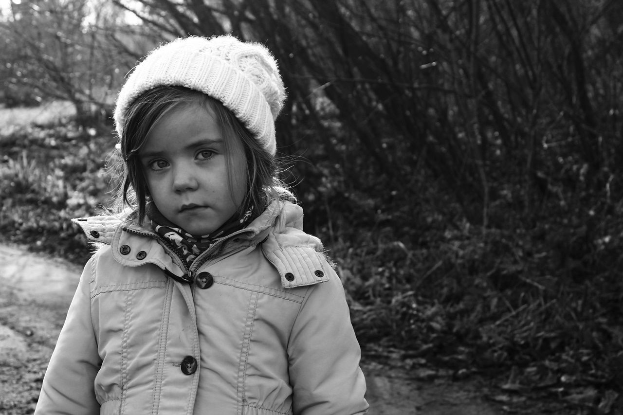 CLOSE-UP PORTRAIT OF GIRL WITH TREE AGAINST TREES