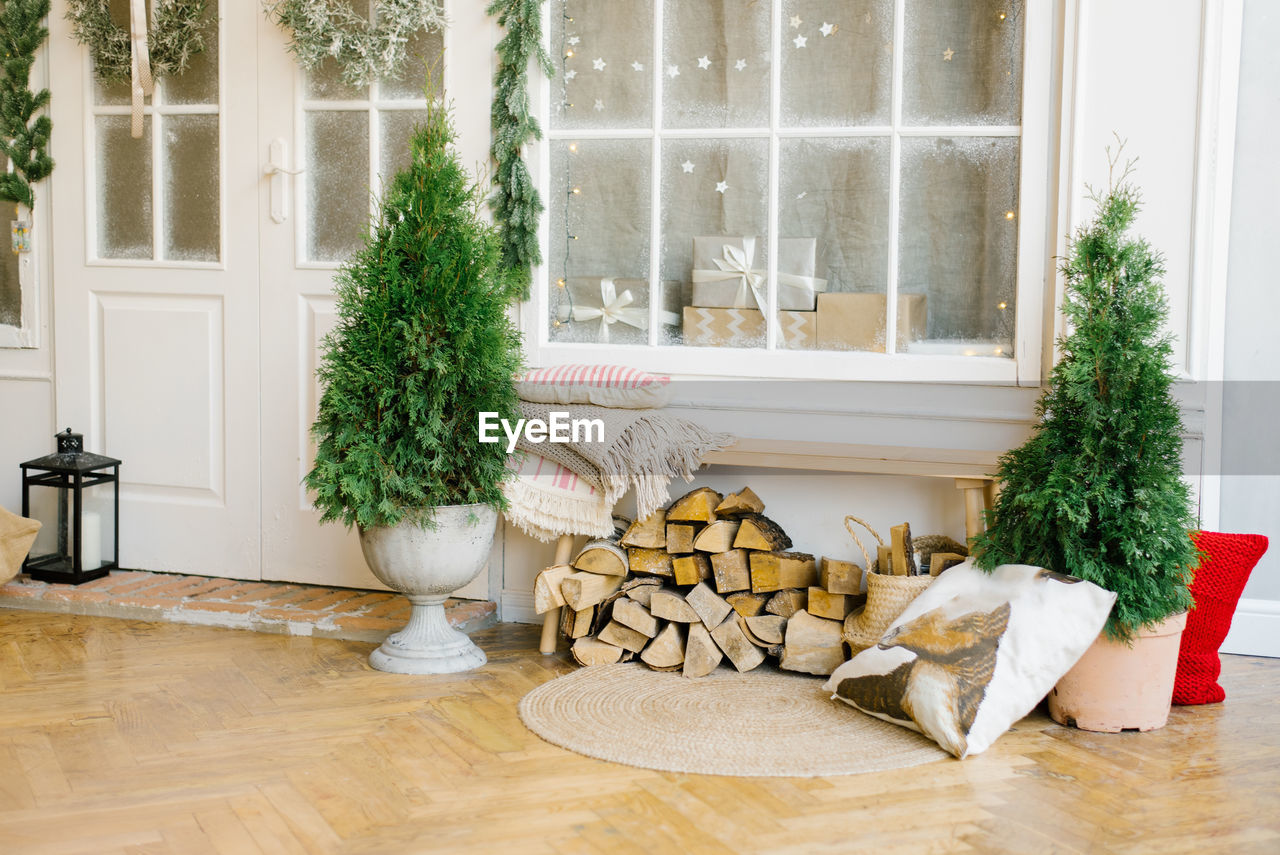 Christmas facade of the house. white doors with christmas wreaths on the doors 