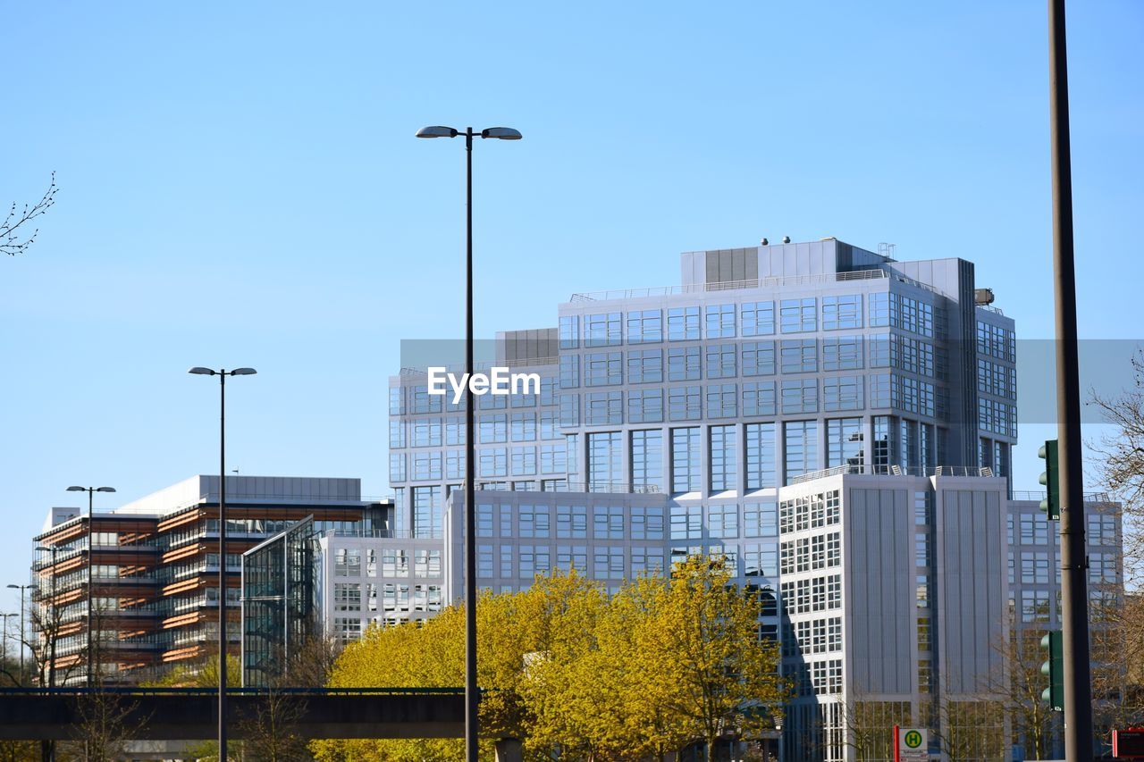 Low angle view of modern buildings against clear sky