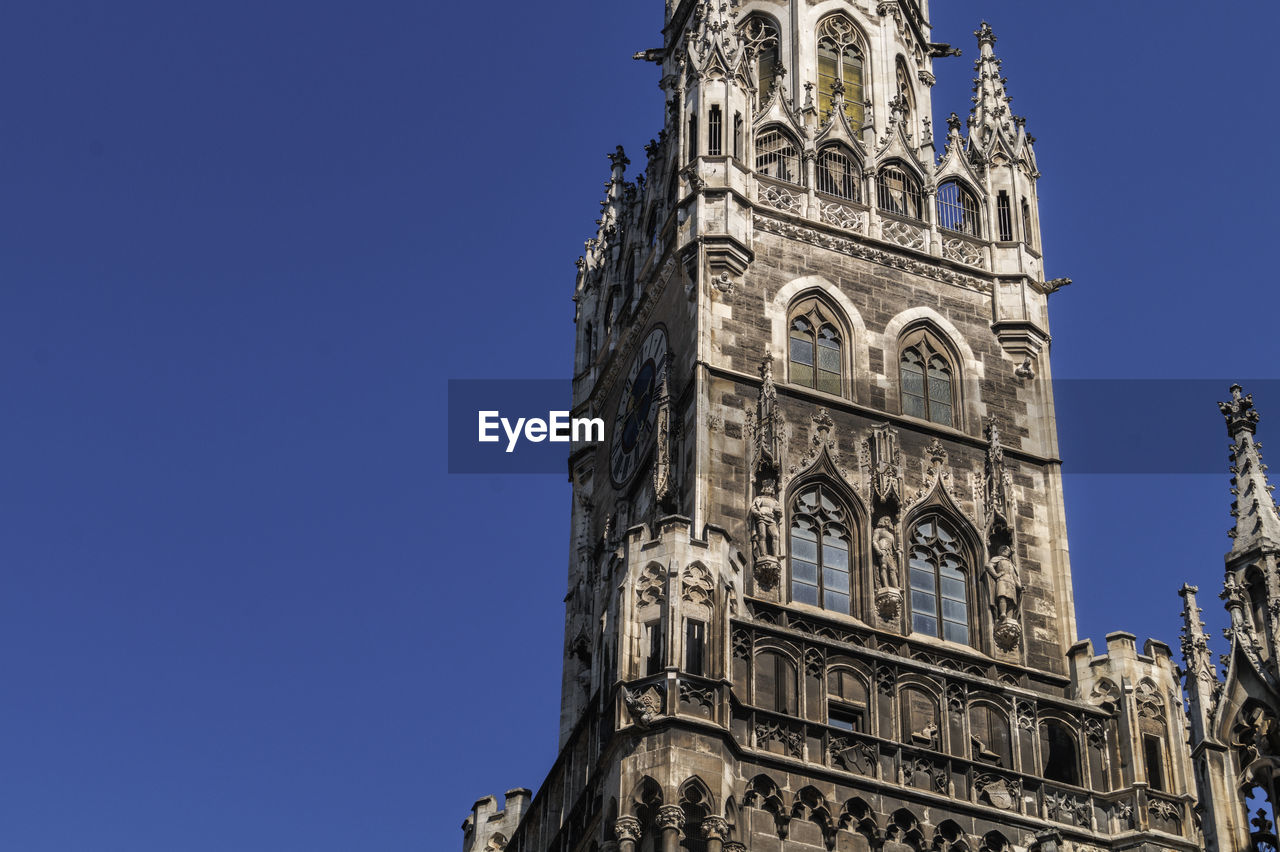 LOW ANGLE VIEW OF BELL TOWER AGAINST CLEAR SKY