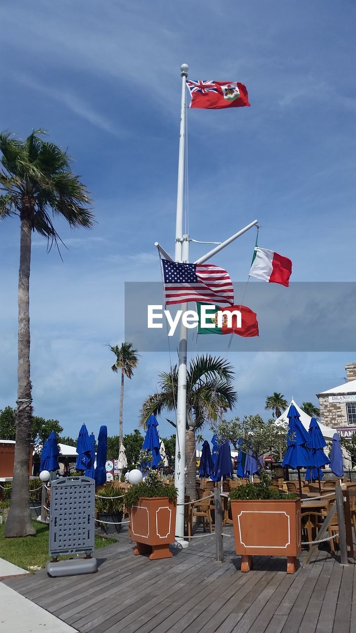 Flags against blue sky