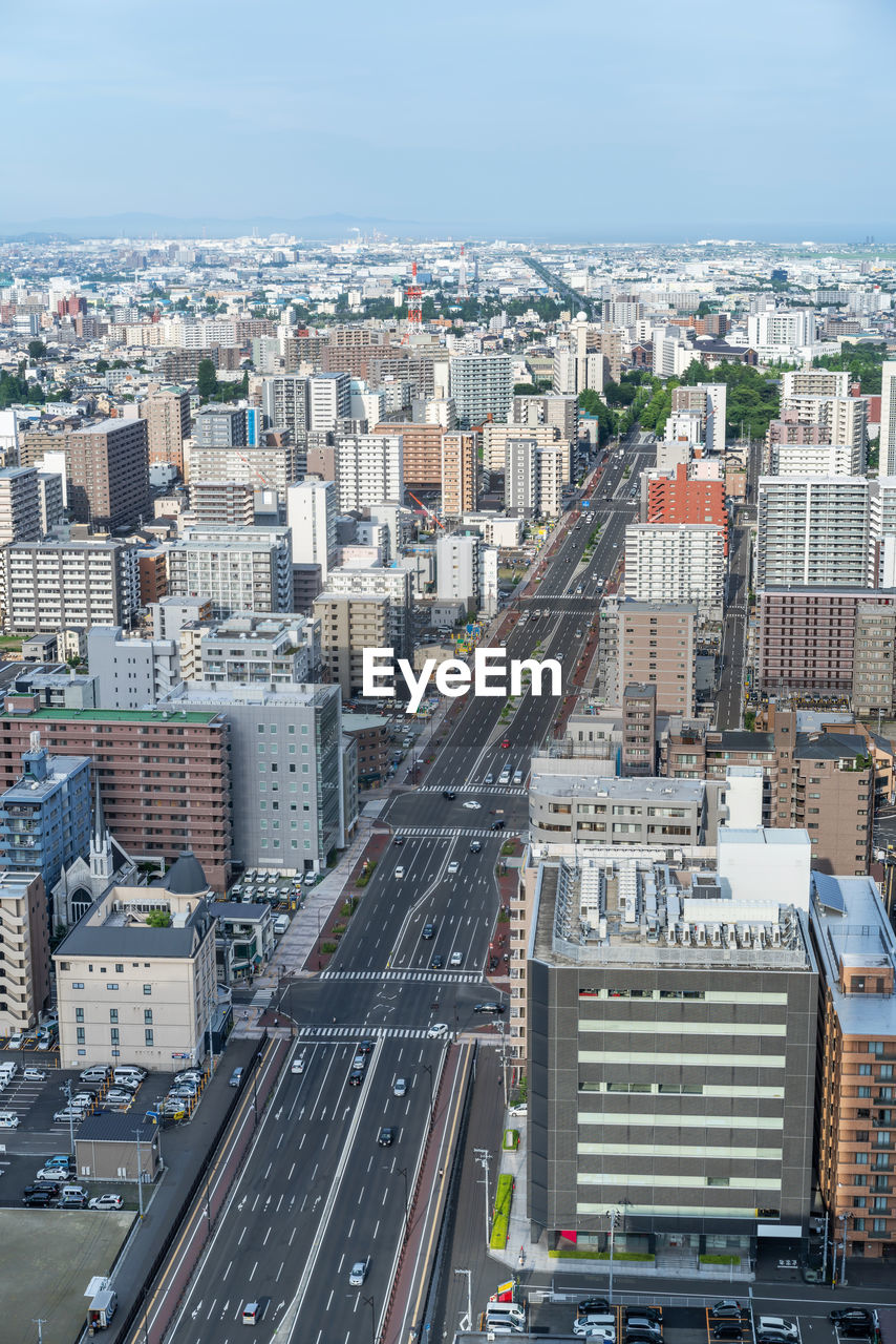 High angle view of buildings in city against sky