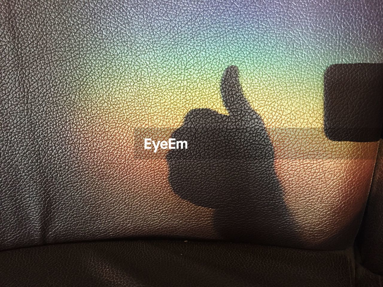 Shadow of hand on seat