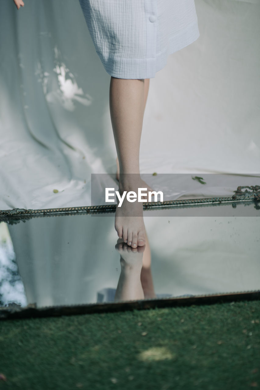 Low section of woman standing on floor