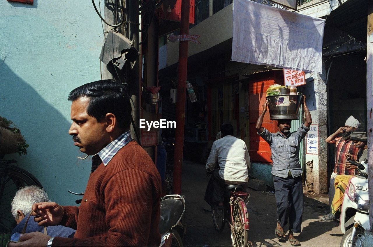 MAN STANDING IN CITY