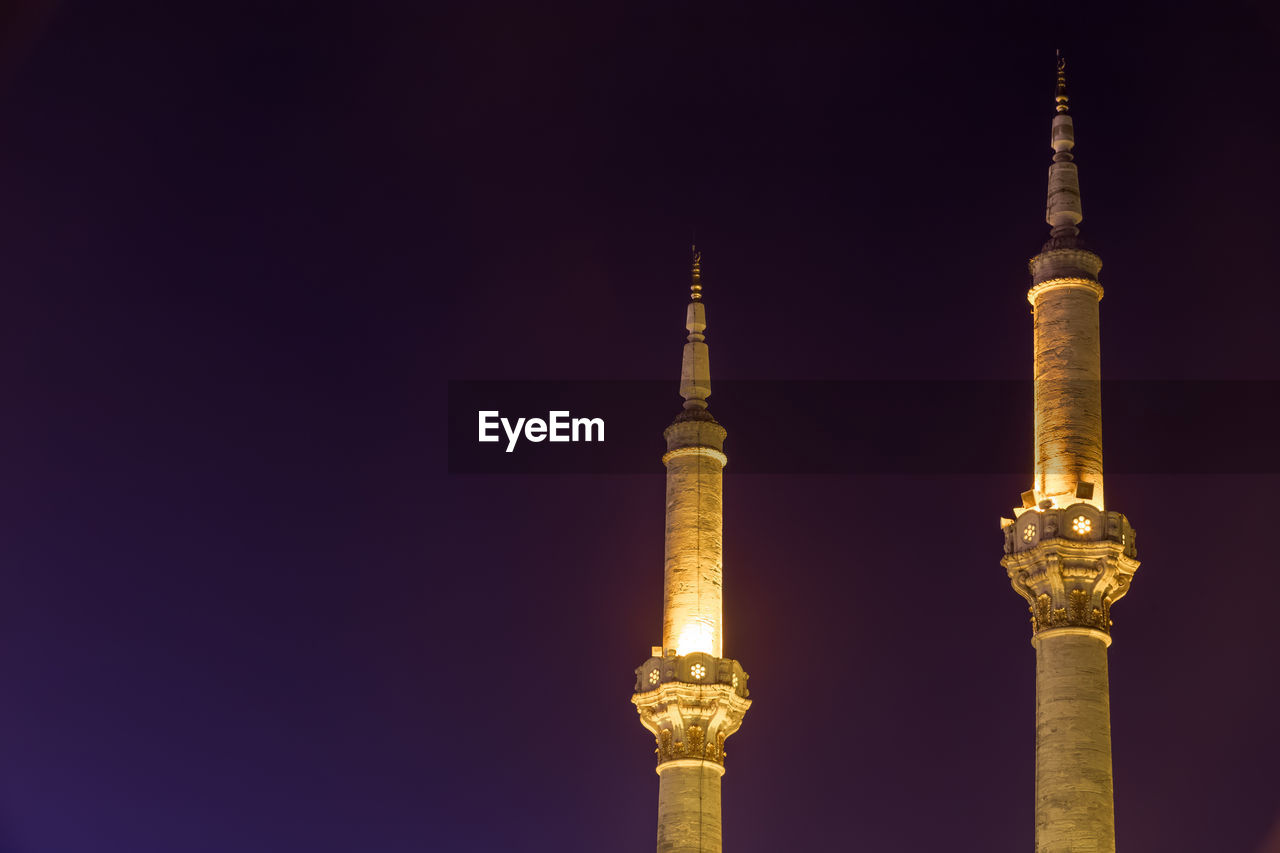MOSQUE AGAINST SKY AT NIGHT