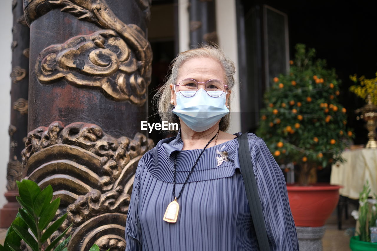 Portrait of woman wearing a mask