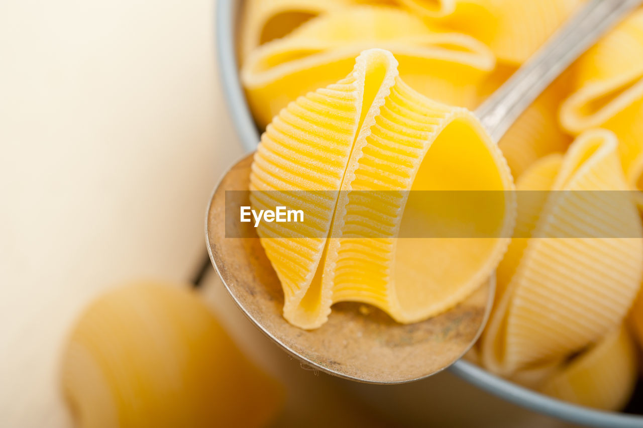 Close-up of lumaconi pasta in bowl on table