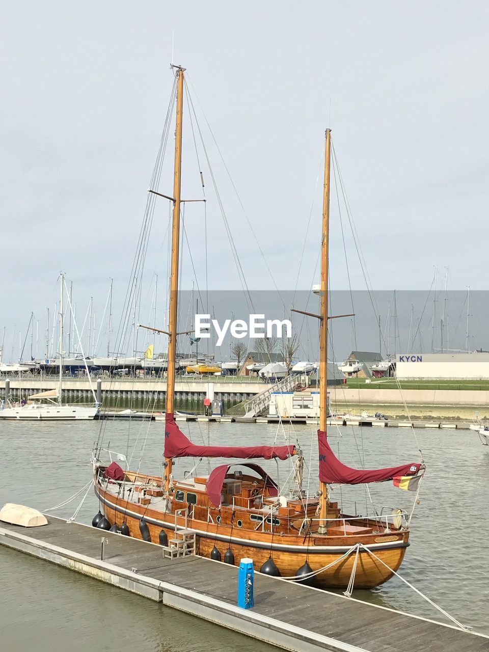 SAILBOATS MOORED IN MARINA