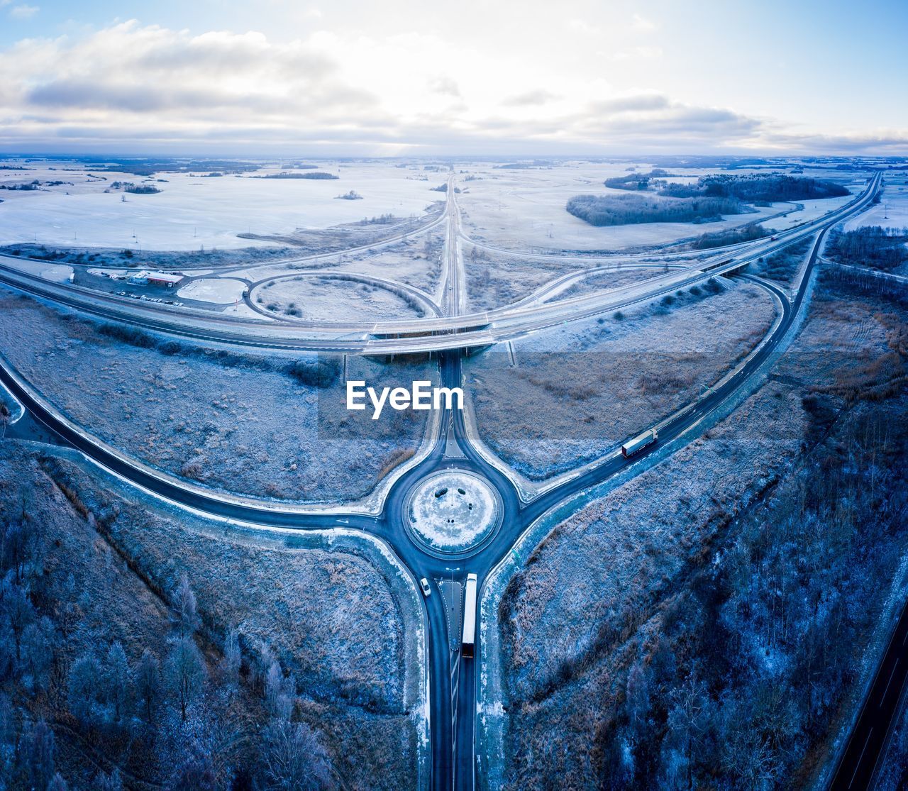 Aerial view of landscape against sky during winter