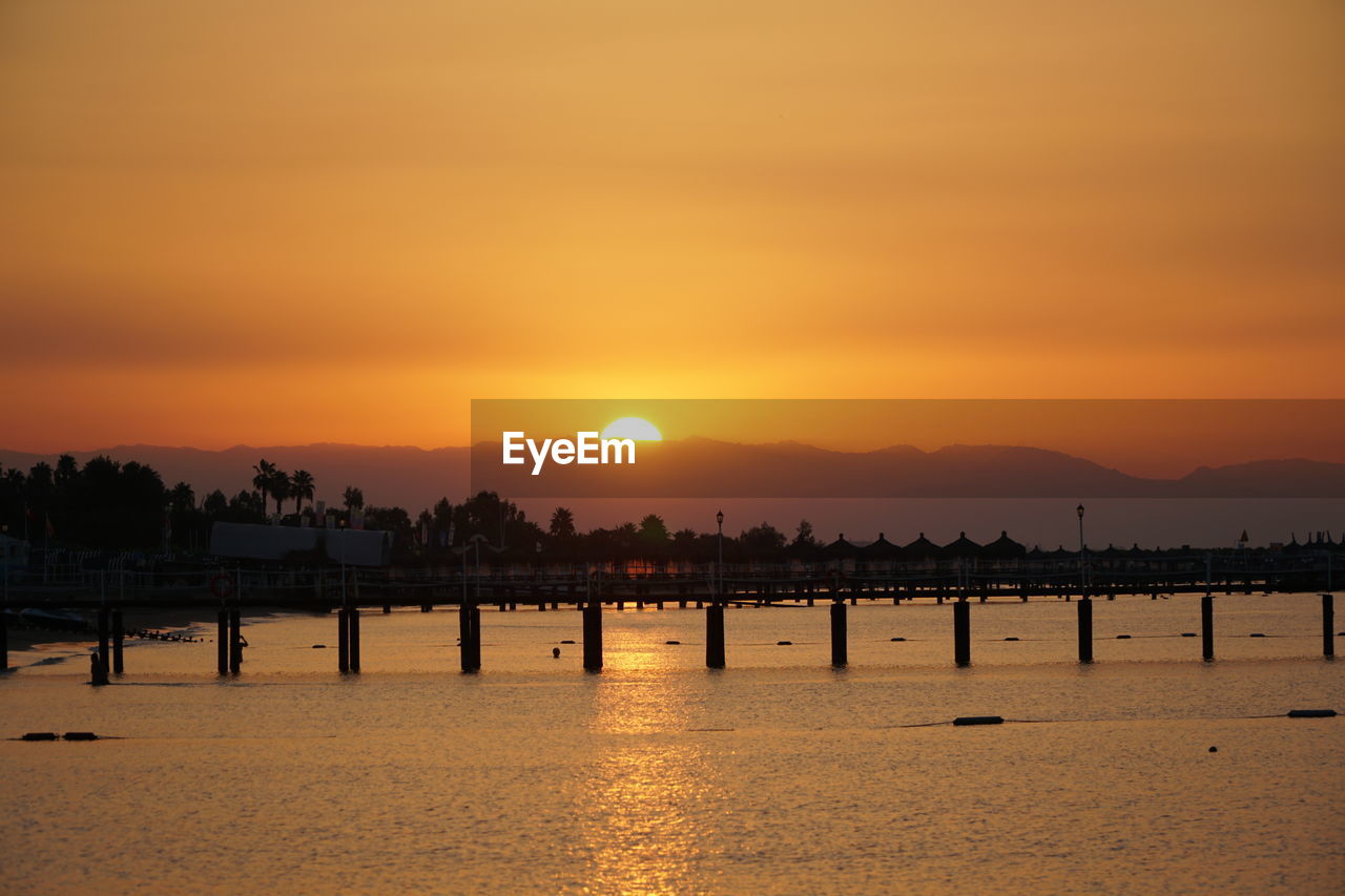 SCENIC VIEW OF SEA AGAINST ROMANTIC SKY