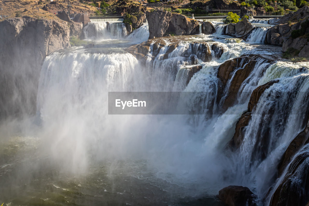 VIEW OF WATERFALL IN ROCK FORMATION