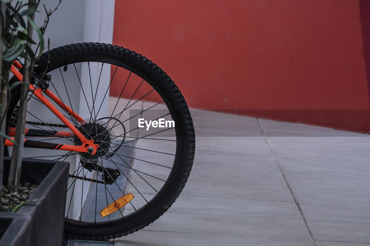 High angle view of bicycle wheel by road