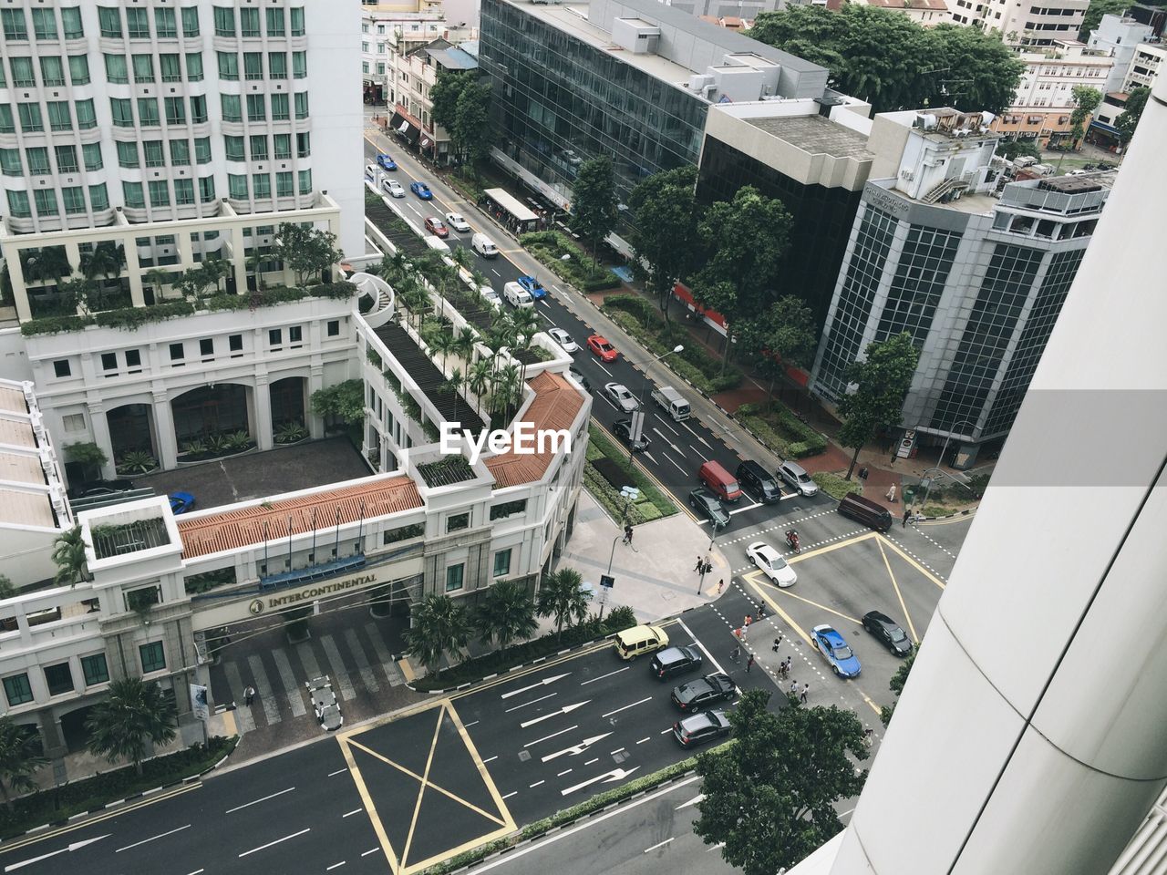 Vehicles on road along buildings