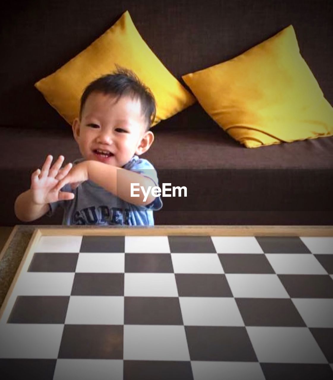 Portrait of happy baby boy playing at home