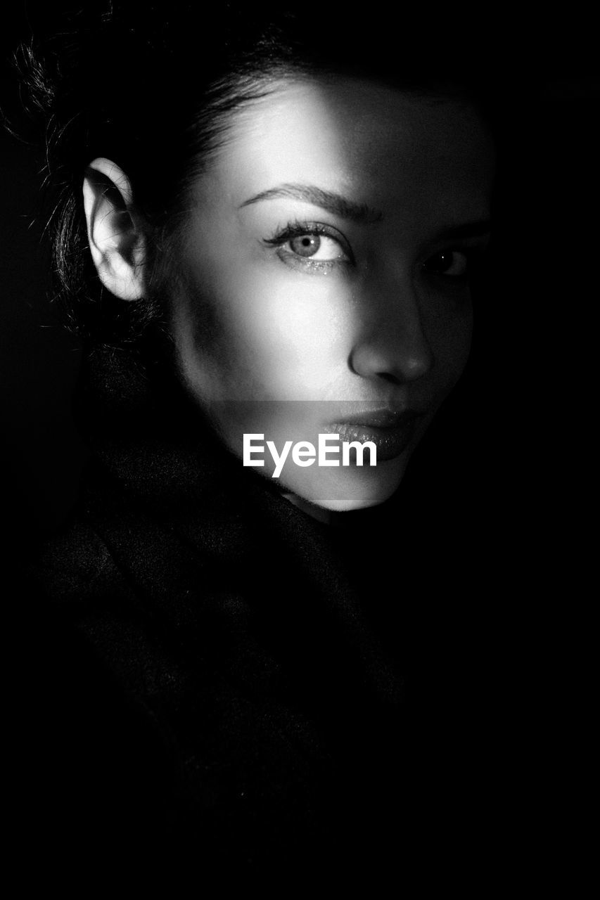 portrait, black and white, black, one person, darkness, women, monochrome photography, human face, adult, young adult, monochrome, looking at camera, headshot, portrait photography, indoors, black background, studio shot, dark, front view, close-up, female, white, person, looking, human eye, serious, lifestyles, photo shoot, emotion, copy space, human head, fashion, contemplation