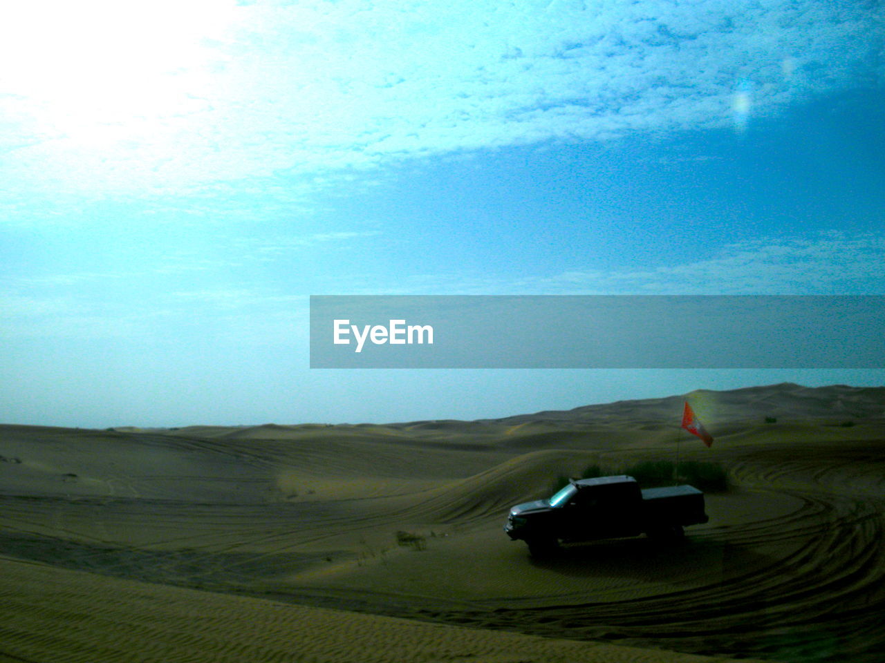 VIEW OF DESERT AGAINST BLUE SKY
