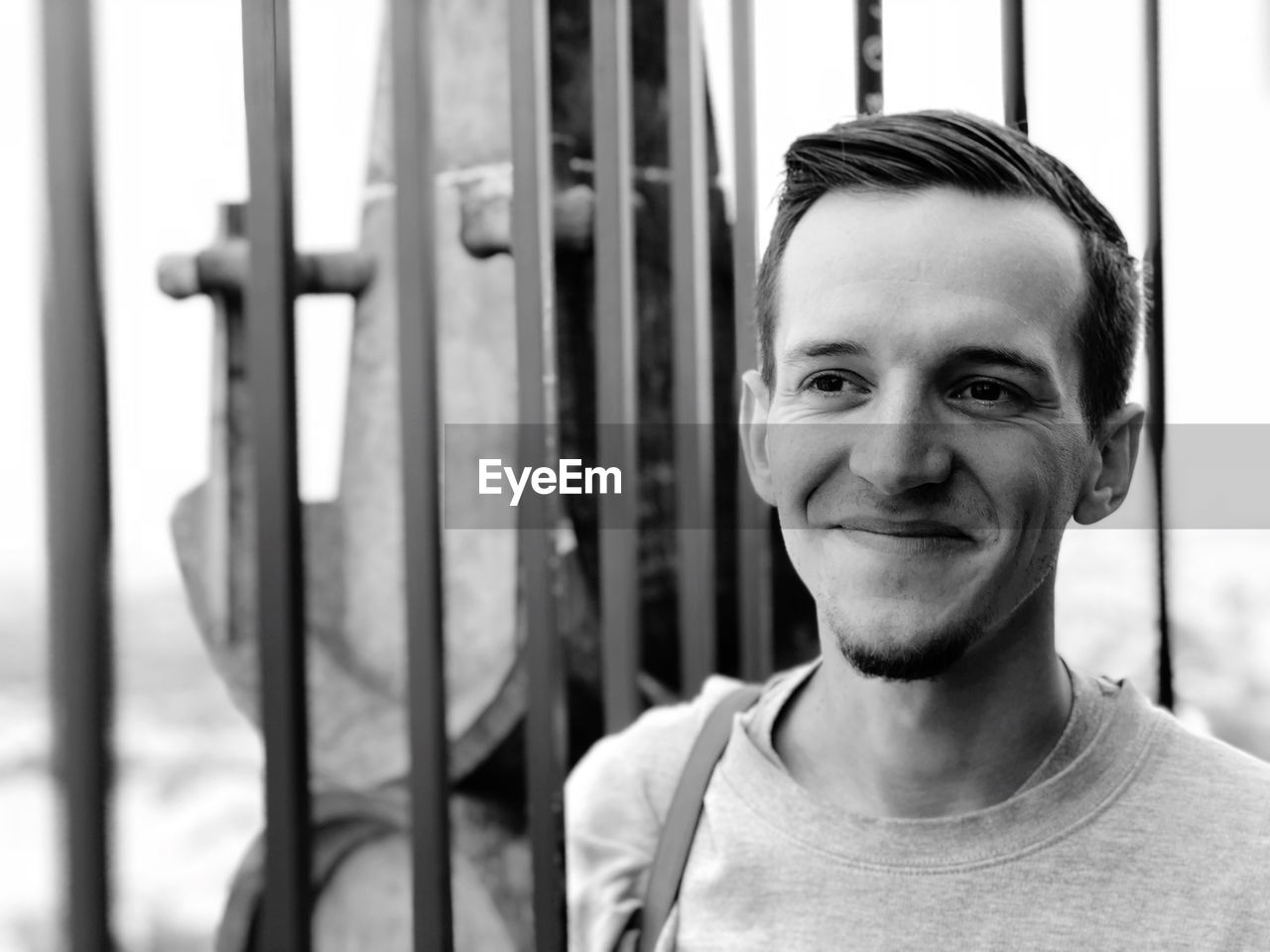 Close-up of smiling young man looking away