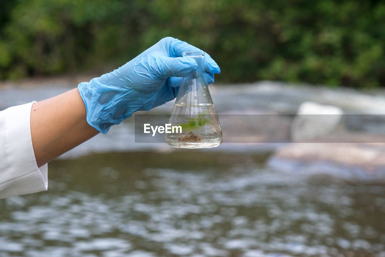 midsection of man holding water