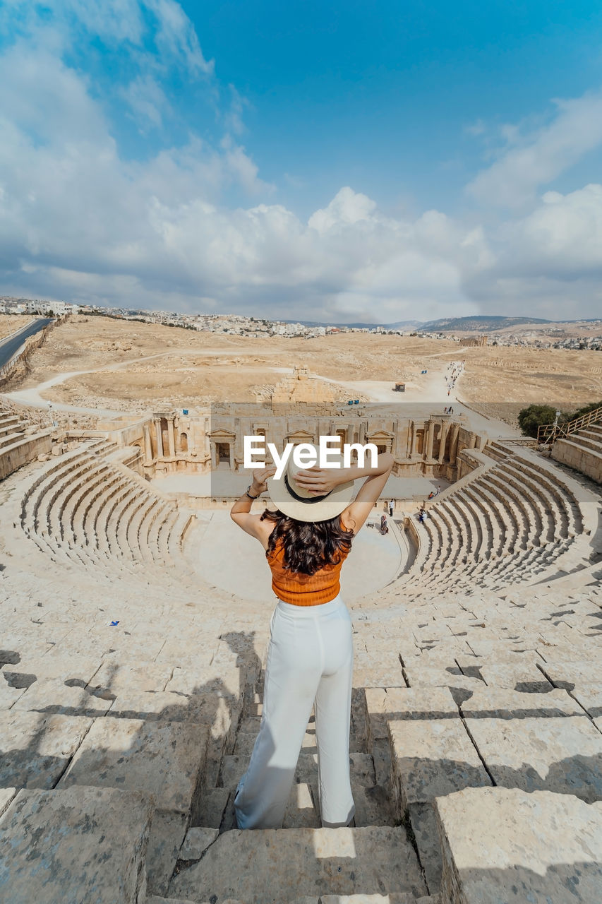 Full length of woman standing at historic amphitheater