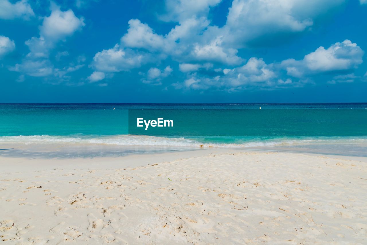 Scenic view of sea against blue sky