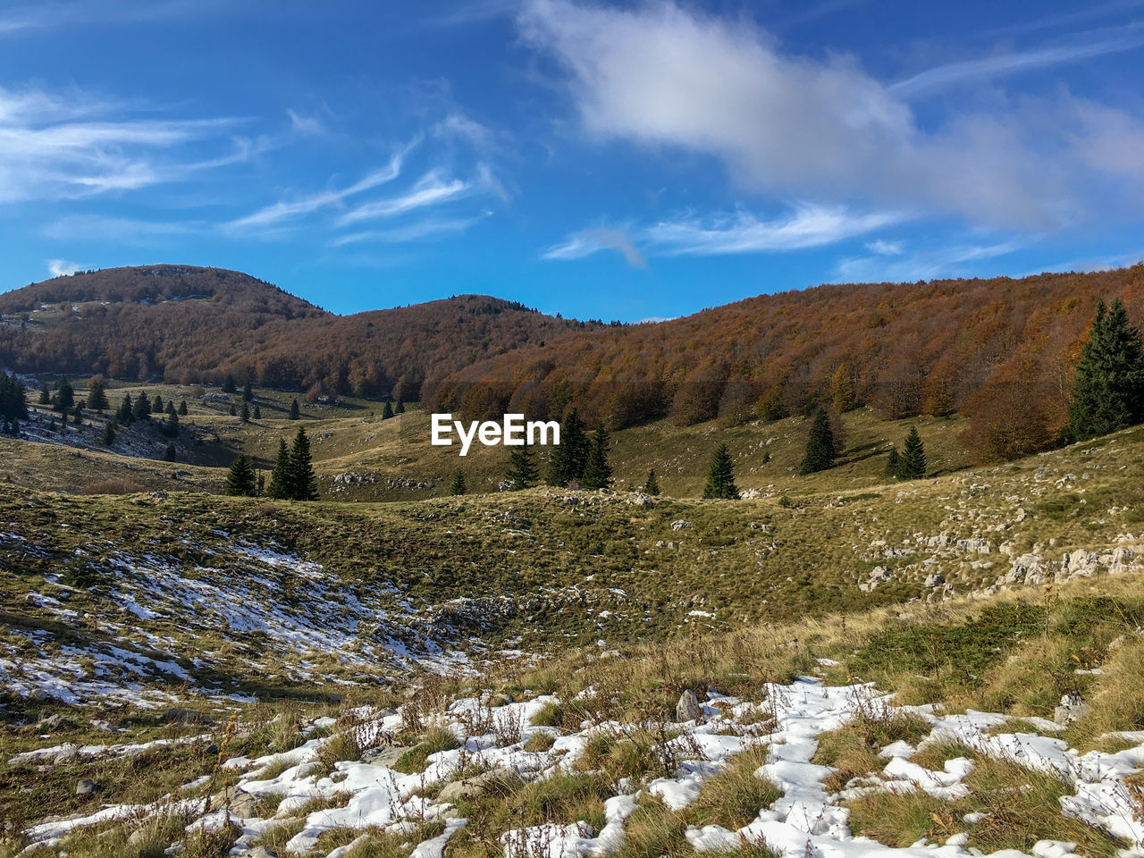 Mountain hiking trail with snow against blue sky in velebit mountain, croatia