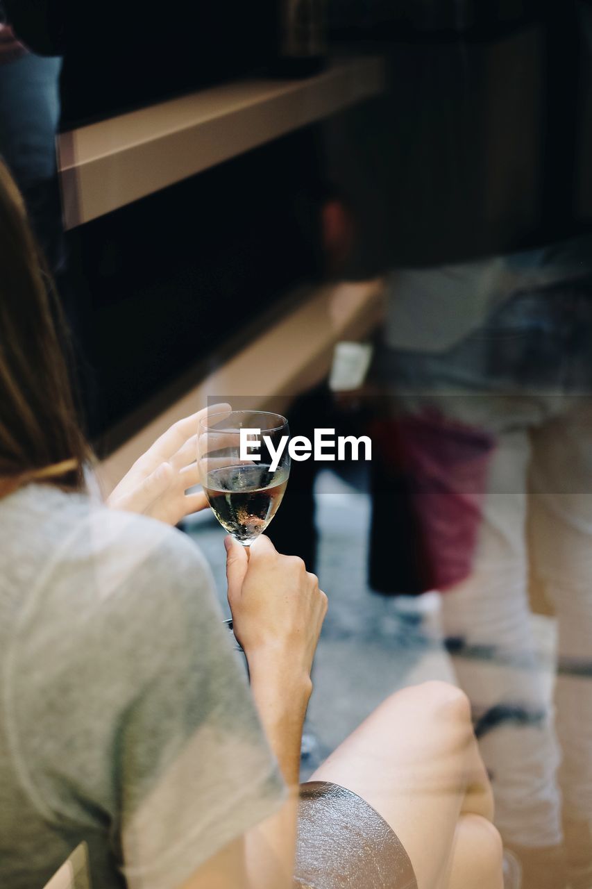 Close-up of woman drinking glass