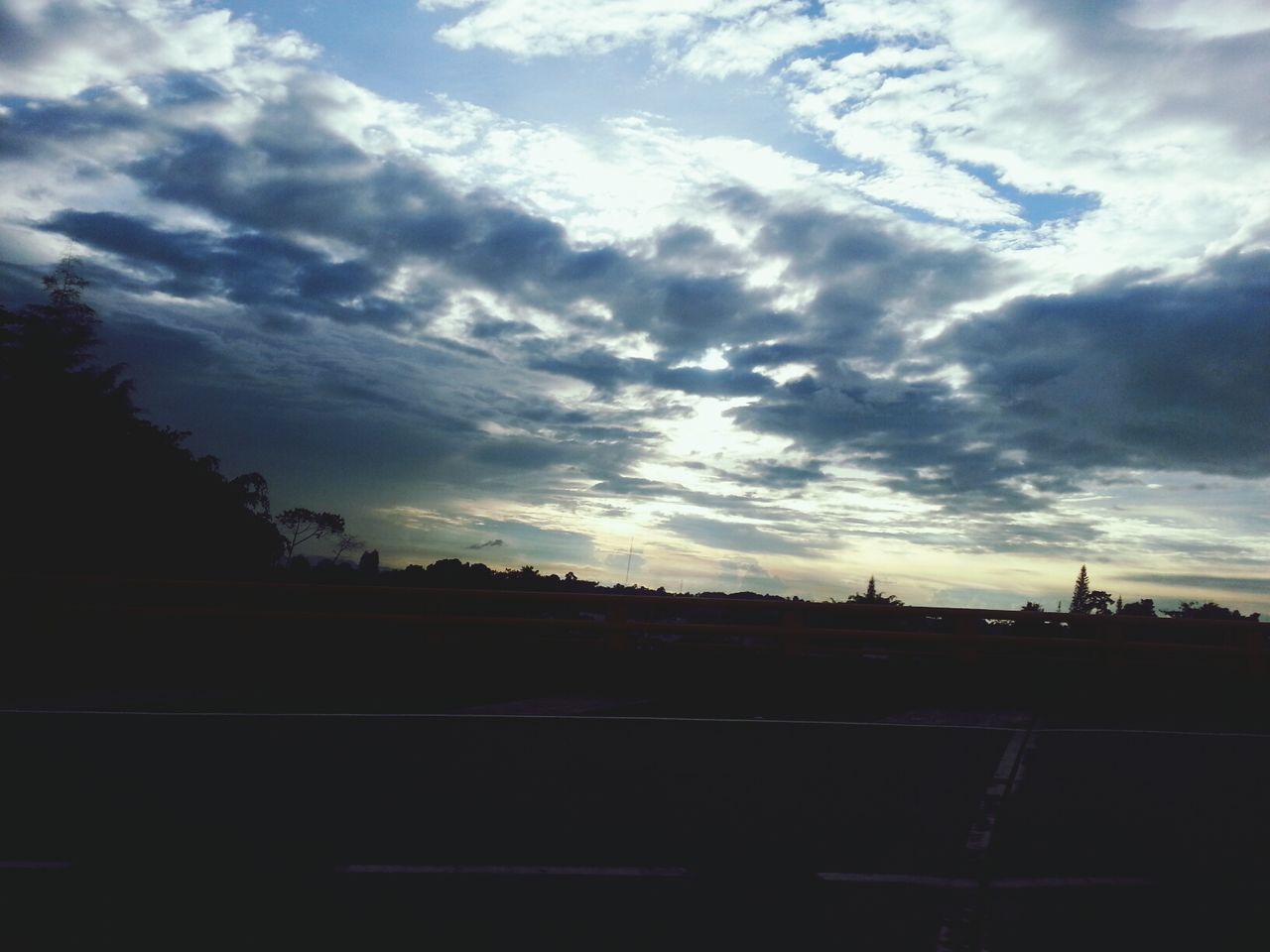 CLOUDY SKY OVER LANDSCAPE