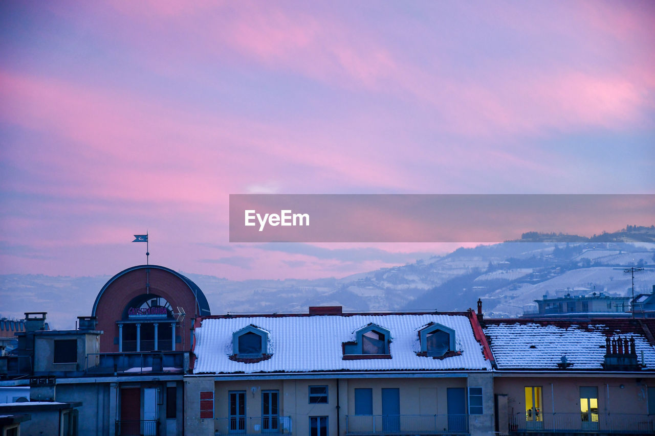 BUILDINGS AGAINST SKY DURING SUNSET