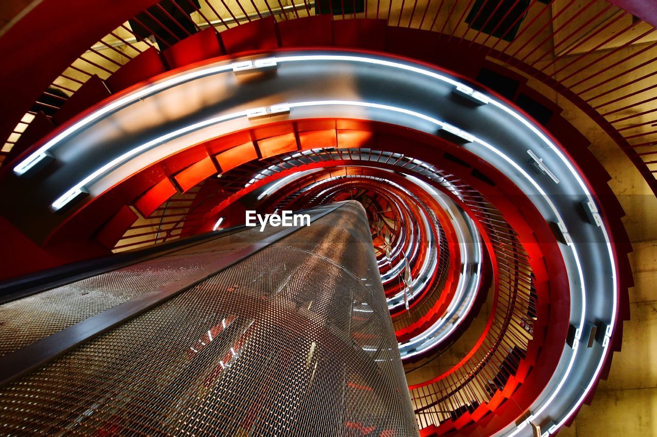 HIGH ANGLE VIEW OF ILLUMINATED STAIRCASES IN BUILDING