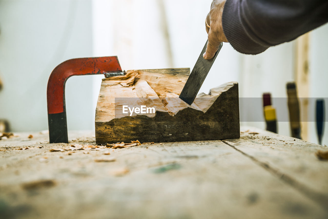 Close-up of carpenter working on wood