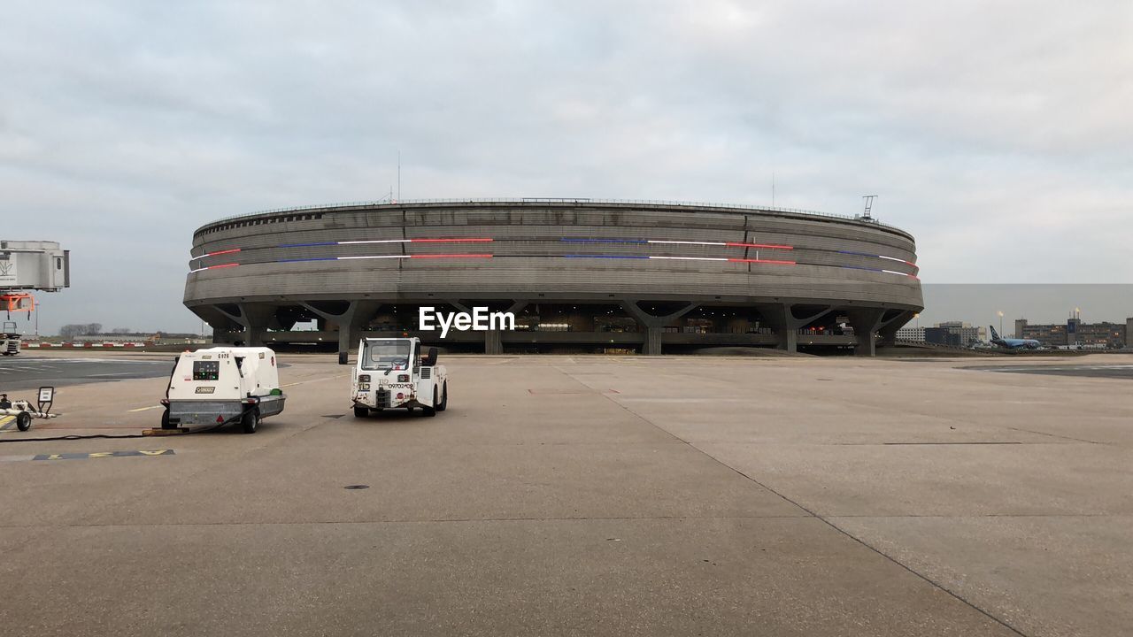 CARS MOVING ON CAR AGAINST SKY