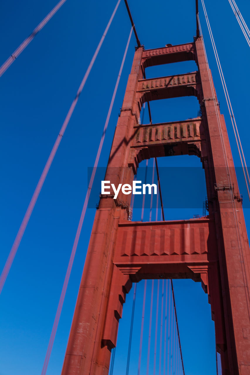 Architectural detail of golden gate bridge against clear blue sky