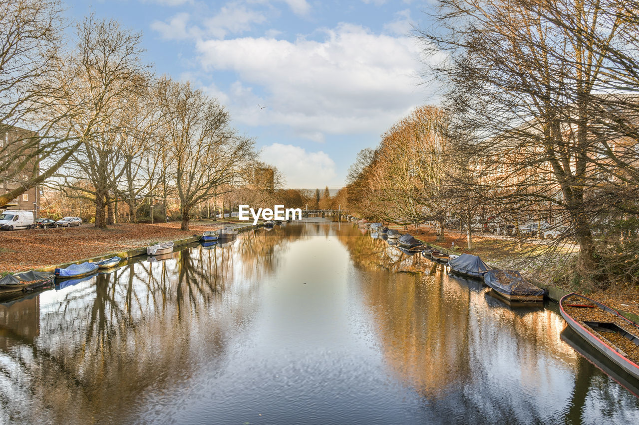 scenic view of river against sky during autumn