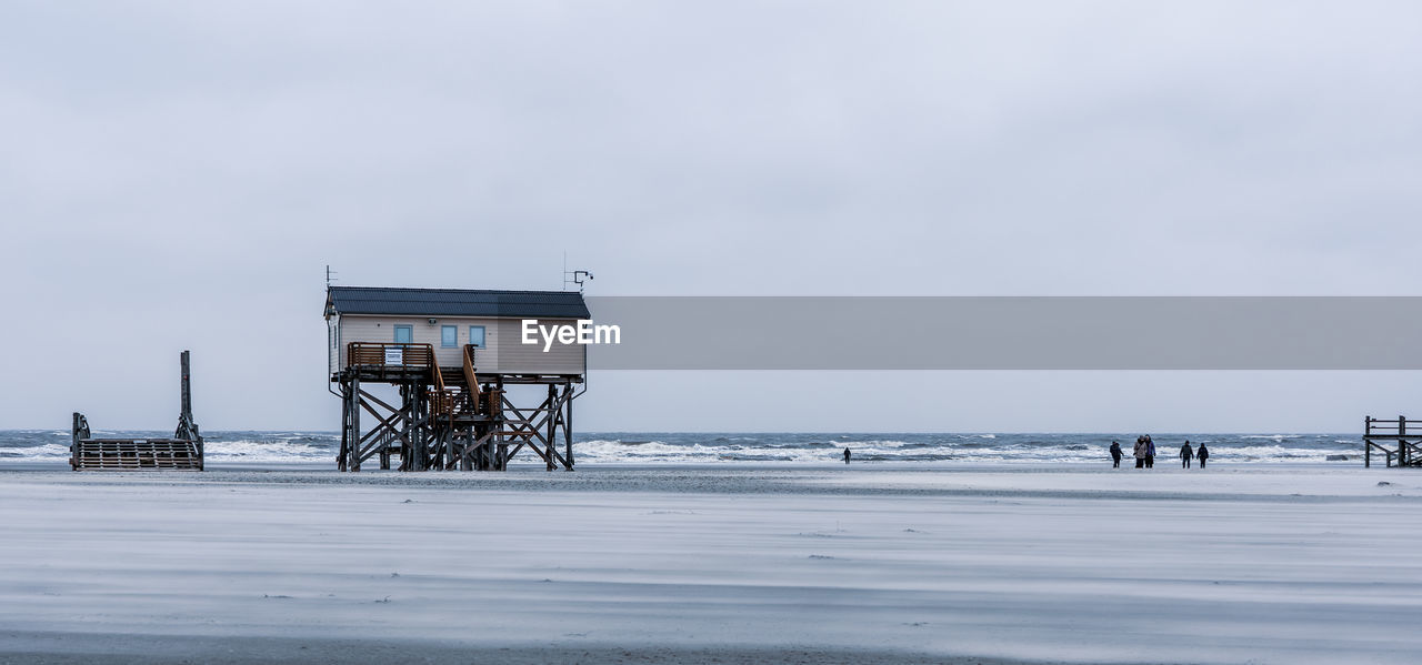 Pile dwelling on the beach of sankt peter-ording in germany.