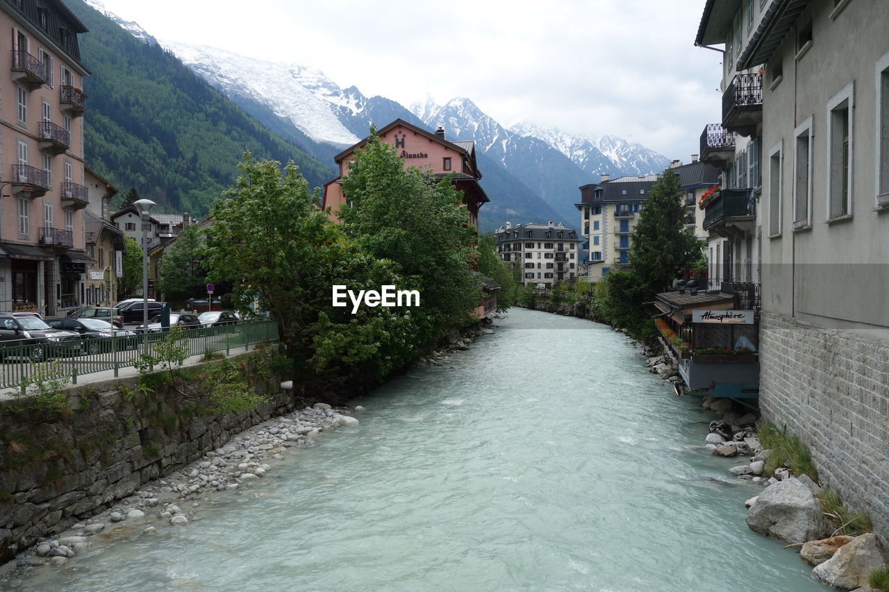 RIVER AMIDST BUILDINGS AND TOWN